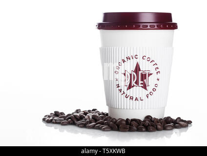 LONDON, UK - APRIL 15, 2019: Pret a Manger Coffee Paper Cup with fresh coffee beans on white. Stock Photo