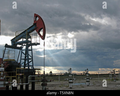 Pump on sunset. West Siberia. Stock Photo
