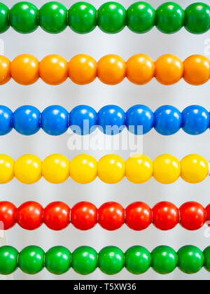 20th-century abacus with colored balls background Stock Photo