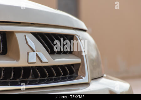 'Northern Emirate, RAK/UAE - 3/30/2019: 'A beige Mitsubishi Pajero front grill shot with chrome logo.' Stock Photo