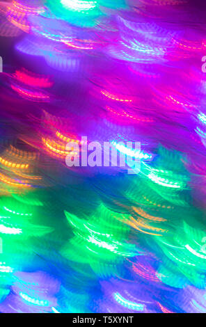 Abstract luminous seamless background of blurred multicolored neon lights.  Stock Photo
