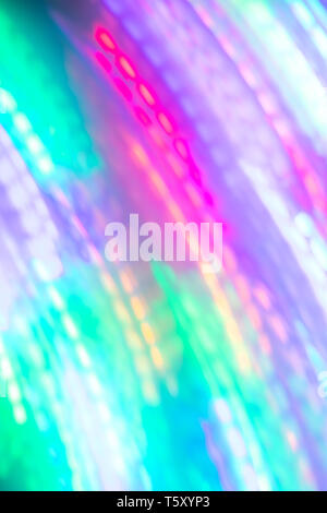 Abstract blurred luminous background of diagonal neon lines. Stock Photo
