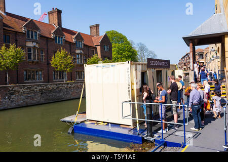Tourists queue for tickets to punts at Scudamores quay on the River Cam, University town of Cambridge, Cambridgeshire, England