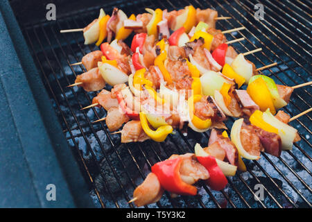 Barbecue Kabobs Smoking On The Grill. Smoked Meat And Vegetables. Grilling Kebabs On The Barbeque. Selective Focus With Copy Space. Stock Photo