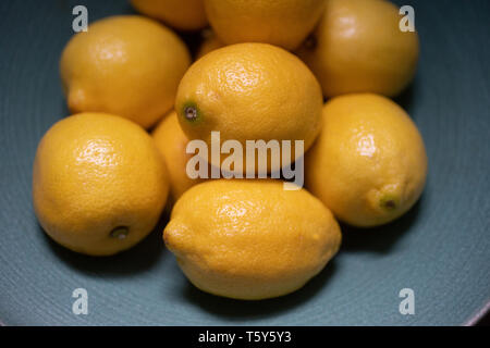 lemons in a green bowl Stock Photo