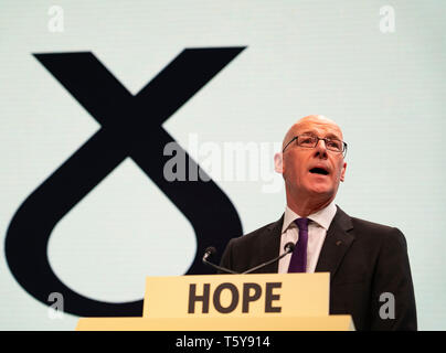 Edinburgh, Scotland, UK. 27 April, 2019. SNP ( Scottish National Party) Spring Conference takes place at the EICC ( Edinburgh International Conference Centre) in Edinburgh. Pictured; Deputy First Minister John Swinney addresses the delegates at the conference Credit: Iain Masterton/Alamy Live News Stock Photo