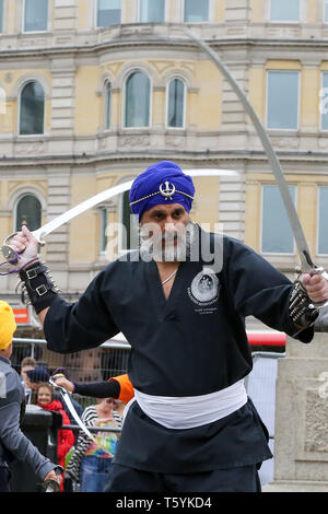 A member of Gatka - The Sikh Martial Art seen performing martial arts at Trafalgar Square during the festival. The Vaisakhi Festival is a religious festival that marks the Sikh New Year. This year's celebrations took place on 14 April which commemorates the beginning of Sikhism as a collective faith and London's celebrations are an opportunity for people from all communities, faiths and backgrounds to experience a festival that is celebrated by Sikhs who live in the capital and over 20 million people across the world. Stock Photo