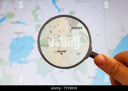 Nairobi, Kenya. Political map. City visualization illustrative concept on display screen through magnifying glass in the hand. Stock Photo
