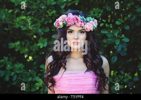Summer woman in flowers crown outdoor portrait Stock Photo