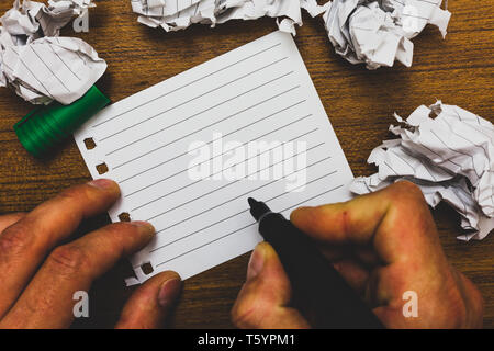 Design business concept Empty copy text for Web banners promotional material mock up template. Man holding marker notebook page crumpled papers severa Stock Photo