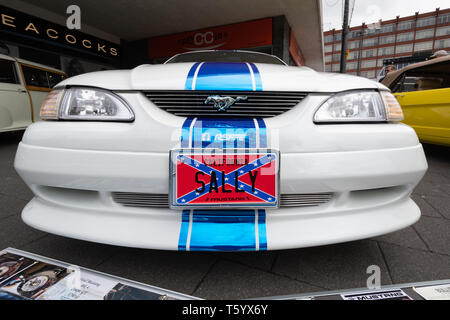 White Ford Mustang Mk4 Coupe GT car with blue stripe and Mustang Sally California licence plate (registration) at a UK classic motor vehicle show Stock Photo