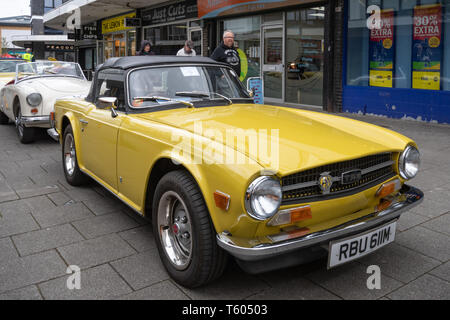 Yellow 1973 Triumph TR6 car at a classic motor vehicle show in the UK Stock Photo