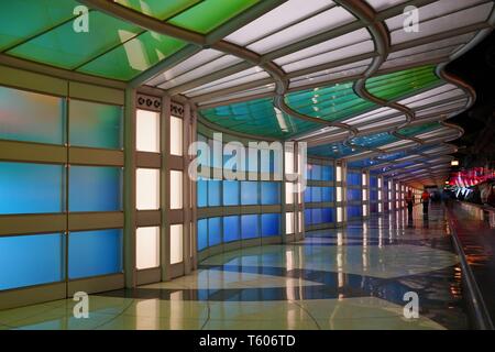 CHICAGO, IL -25 APR 2019- View of the colored electric neon tunnel The Sky Is the Limit at Chicago O'Hare International Airport (ORD) connecting the B Stock Photo