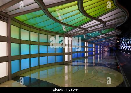 CHICAGO, IL -25 APR 2019- View of the colored electric neon tunnel The Sky Is the Limit at Chicago O'Hare International Airport (ORD) connecting the B Stock Photo