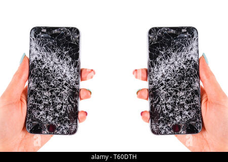 Woman hand holding modern mobile smartphone broken screen and damages. Cellphone crashed and scratch. Device destroyed. Smash gadget, need repair. Iso Stock Photo