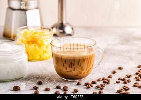 Coffee blended with ghee butter and MCT coconut oil, paleo, keto, ketogenic drink breakfast. Stock Photo