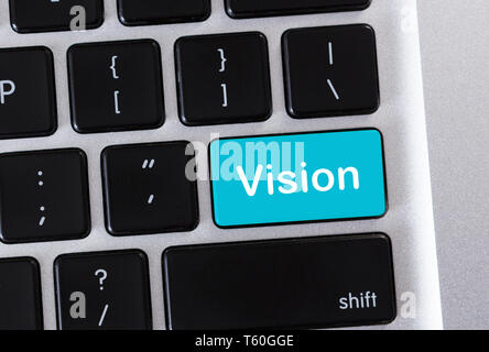 Laptop keypad with text Vision on blue button Stock Photo