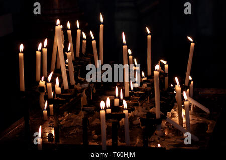 Candles lit in a church Stock Photo