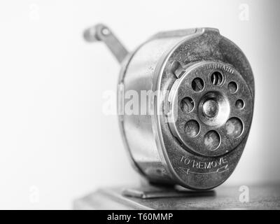 Old mounted pencil sharpener. Stock Photo