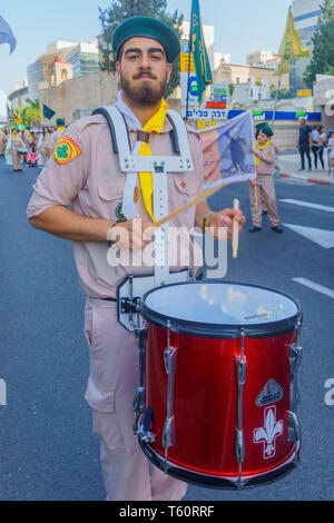 Haifa, Israel - April 27, 2019: Scouts take part in a Holy Saturday parade, part of Orthodox Easter celebration in Haifa, Israel Stock Photo