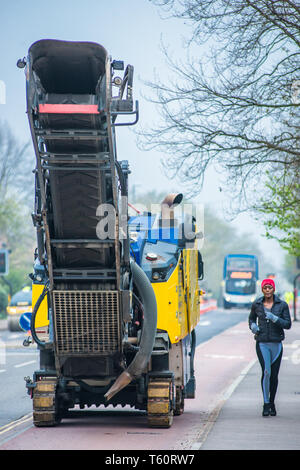 Asphalt Milling / cold planer machine used on Huntingdon Rd in Cambridge, UK. Stock Photo