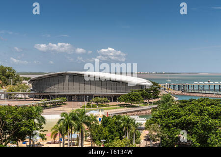 Darwin Australia - February 22, 2019: Closeup of Convention Centre in harbour, with green vegetaion around under blue evening sky. Stock Photo