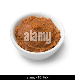 Bowl with Japanese miso paste as an ingredient isolated on white background Stock Photo