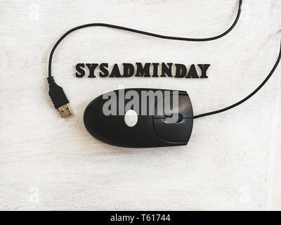 Beautiful greeting card for Sysadmin Day. Wooden letters with a congratulatory inscription on a white background. Close-up, top view. Congratulations  Stock Photo