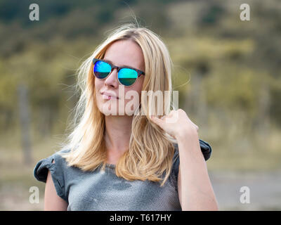 young pregnant woman posing in nature Stock Photo