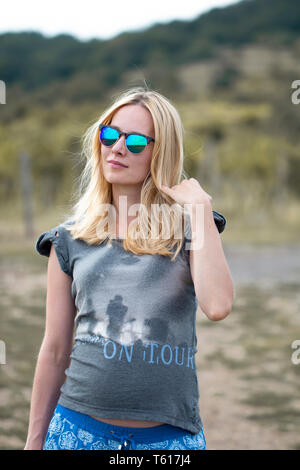 young pregnant woman posing in nature Stock Photo