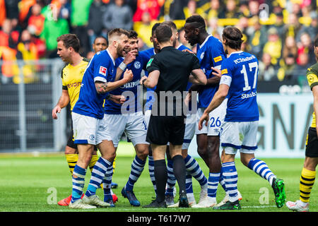 27 april 2019 Dortmund, Germany Soccer German Bundesliga Borussia Dortmund v Schalke 04   L-R players of Schalke 04 with Scheidsrechter Daniel Siebert (Berlin) Stock Photo