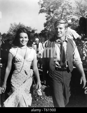 Natalie Wood Robert Redford and behind cinematographer James Wong Howe THIS PROPERTY IS CONDEMNED 1966 on set location candid filming director Sydney Pollack play Tennessee Williams screenplay Francis Ford Coppola  Seven Arts Productions / Paramount Pictures Stock Photo