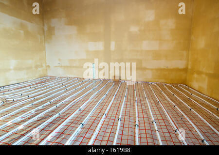 Close up on water floor heating system interior Stock Photo