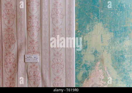Wallpaper peeling off an old, abandoned house Stock Photo