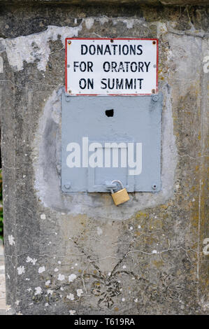 Collection box at foot of St Patrick's statue, Croagh Patrick, 'Donations for Oratory on Summit' Stock Photo