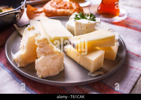 Traditional white feta cheese on the plate for turkish breakfast Stock Photo