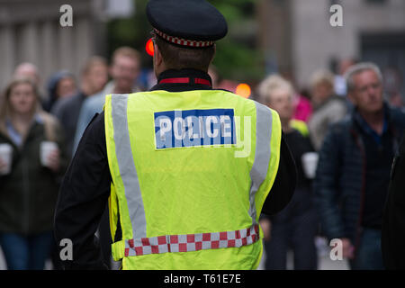 Back of a police office at the 2019 London marathon. Stock Photo