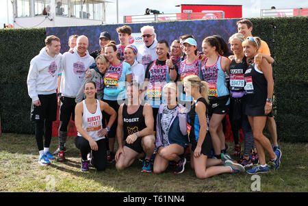 Chris Evans (centre), Kirsty Gallacher (bottom left), Helen Skelton (bottom right) with the Team Barbara's Revolutionaries Jamie Borthwick, Jake Wood, Emma Barton, Kellie Shirley, Tanya Franks, Scott Mitchell and Natalie Cassidy prior to the 2019 Virgin Money London Marathon. Stock Photo