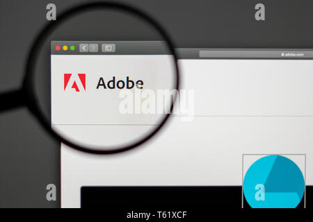 Adobe company website homepage. Close up of Adobe logo. Can be used as illustrative for news media or other websites, marketing or business concept Stock Photo