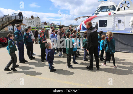 Isle of Wight, UK. 28th Apr 2019. Actor Warwick Davis flew in from filming in the USA with Angelina Jolie to meet Scouts on the Isle of Wight, in his role as Scout Ambassador. The Harry Potter actor and presenter of Tenable is filming the Maleficent sequel, Mistress of Evil, but took time to meet with 66 Scouts chosen from each of the 23 Scout troupes on the Isle of Wight. Warwick came to the Hovertravel terminal to meet the Scouts and got behind the controls of a hovercraft. Credit: uknip/Alamy Live News Stock Photo