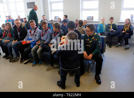 Isle of Wight, UK. 28th Apr 2019. Actor Warwick Davis flew in from filming in the USA with Angelina Jolie to meet Scouts on the Isle of Wight, in his role as Scout Ambassador. The Harry Potter actor and presenter of Tenable is filming the Maleficent sequel, Mistress of Evil, but took time to meet with 66 Scouts chosen from each of the 23 Scout troupes on the Isle of Wight. Warwick came to the Hovertravel terminal to meet the Scouts and got behind the controls of a hovercraft. Credit: uknip/Alamy Live News Stock Photo