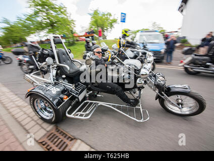 Hessen, Germany. 28th Apr, 2019. A motorcyclist rides after the service in the mountain church on his trike at the motorbike parade. Photo: Andreas Arnold/dpa Credit: dpa picture alliance/Alamy Live News Stock Photo