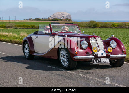 East Lothian, UK. 28 April 2019. Classic Car Tour: North Berwick Rotary Club holds its 3rd rally with 65 classic cars entered. The car rally route is from East Lothian and back through the Scottish Borders, raising money for local charities. A classic vintage 1986 Royale Sabre convertible sports car with the Bass Rock in the background Stock Photo