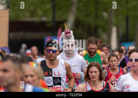 Runner in unicorn costume at London Marathon 2019 Stock Photo