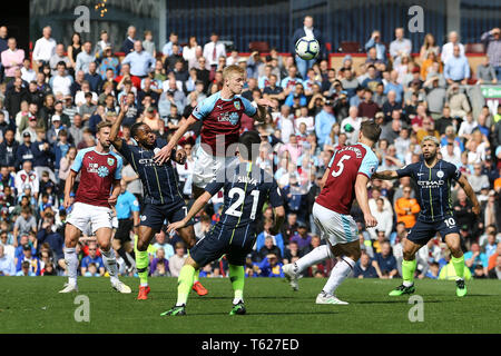 Burnley, UK. 28th Apr, 2019. Ben Mee of Burnley heads the ball clear. Premier League match, Burnley v Manchester City at Turf Moor in Burnley, Lancashire on Sunday 28th April 2019.  this image may only be used for Editorial purposes. Editorial use only, license required for commercial use. No use in betting, games or a single club/league/player publications. pic by Chris Stading/Andrew Orchard sports photography/Alamy Live news Credit: Andrew Orchard sports photography/Alamy Live News Stock Photo