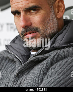 Burnley, UK. 28th Apr, 2019. Manchester City manager Pep Guardiola looks focussed as he takes his seat in the dugout. Premier League match, Burnley v Manchester City at Turf Moor in Burnley, Lancashire on Sunday 28th April 2019.  this image may only be used for Editorial purposes. Editorial use only, license required for commercial use. No use in betting, games or a single club/league/player publications.  Credit: Andrew Orchard sports photography/Alamy Live News Stock Photo