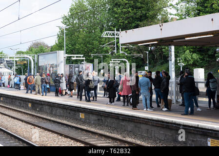 London, UK. 28th Apr, 2019. Passengers wait at a train station as a result of train cancellations to Heathrow Airport due to a fire close to the airport in London, UK, on April 28, 2019. London Fire Brigade said on Sunday there were no reports of any injury after a fire at a warehouse near Heathrow airport caused concern on social media. London Fire Brigade confirmed a container storage yard was alight and witnesses said large black plumes of smoke could be seen billowing into the sky from the airport. Credit: Ray Tang/Xinhua/Alamy Live News