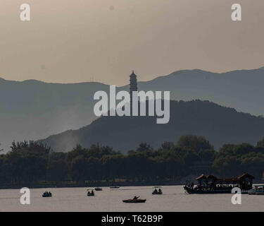 October 19, 2006 - Beijing, China - At twilight in silhouette, the Jade Peak Pagoda stands on Jade Spring Hill above Kunming Lake in the Summer Palace complex, an imperial garden of the Qing Dynasty, a vast ensemble of lakes, gardens and palaces in Beijing, A UNESCO World Heritage Site it is a favorite tourist destination. (Credit Image: © Arnold Drapkin/ZUMA Wire)