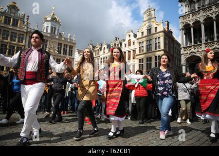 Brussels, Belgium. 28th Apr, 2019. Tourists and performers dance on the last day of the 2019 Balkan Trafik at the Grand Place in Brussels, Belgium, April 28, 2019. The festival aims to share the artistic and festive cultures of the Balkans in south-eastern Europe. Credit: Zheng Huansong/Xinhua/Alamy Live News Stock Photo