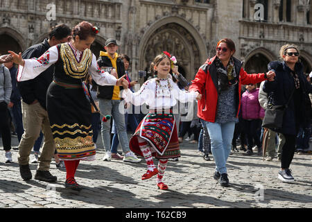 Brussels, Belgium. 28th Apr, 2019. Tourists and performers dance on the last day of the 2019 Balkan Trafik at the Grand Place in Brussels, Belgium, April 28, 2019. The festival aims to share the artistic and festive cultures of the Balkans in south-eastern Europe. Credit: Zheng Huansong/Xinhua/Alamy Live News Stock Photo